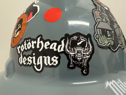 Helmet with various stickers including a prominent 'rotorhead designs' logo.